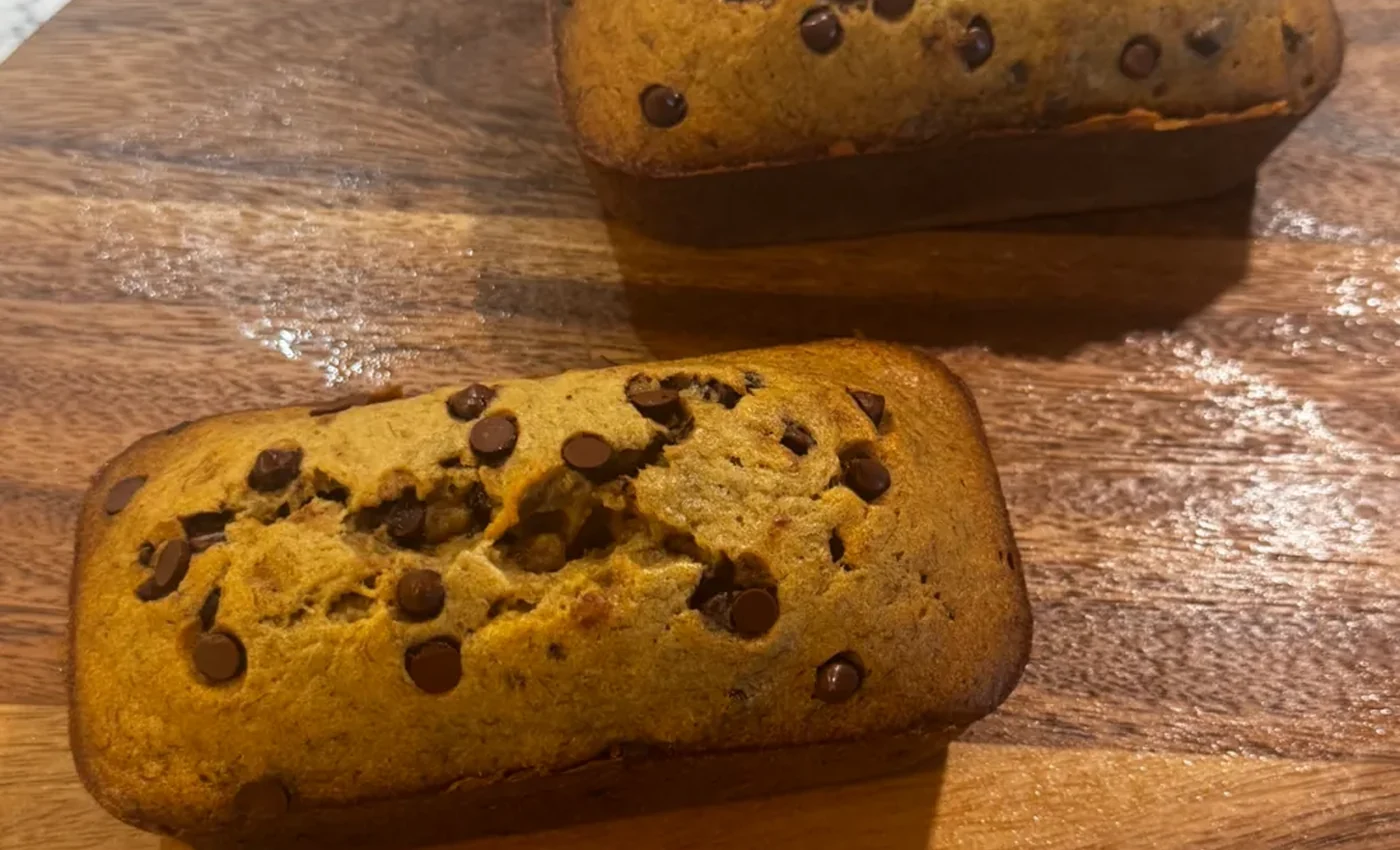 Banana Boss chocolate chip loaves on a wooden board